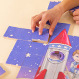 Boy's hand placing a piece together in a wooden puzzle.