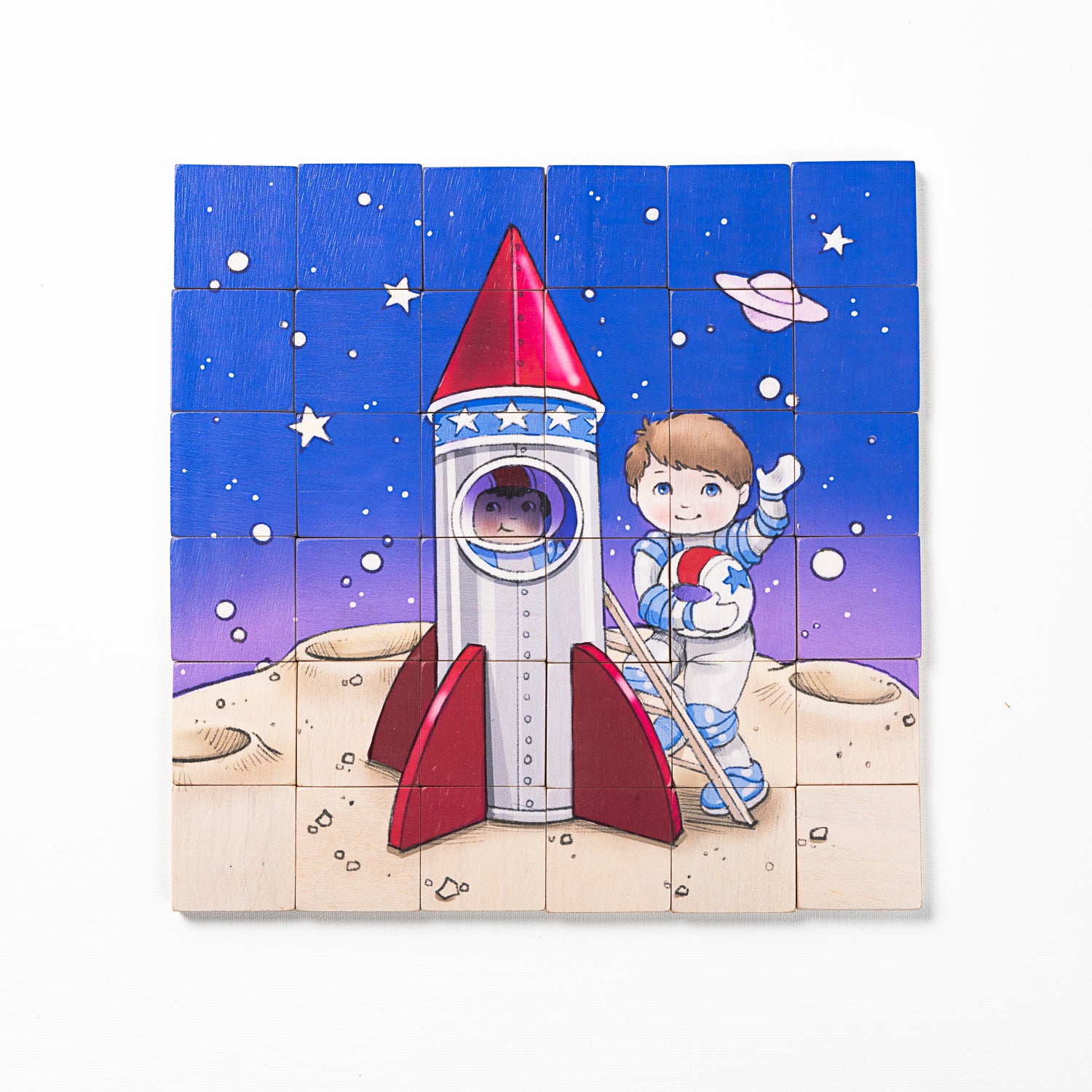 A completed wooden magnetic puzzle depicting an astronaut standing next to a rocket on a space-themed background with stars and a planet.