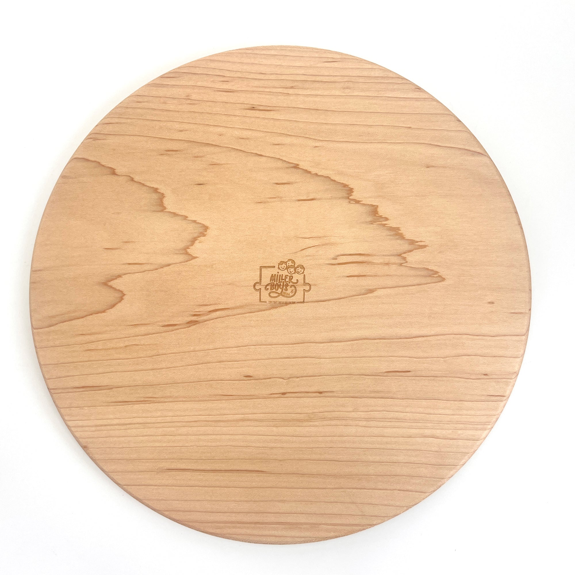 A round wooden cutting board with a natural light oak grain pattern and a small engraved logo in the center, shown on a plain white background.