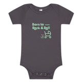 Dark grey baby onesie with "Born to Rock & Roll" in mint color with a baby stroller rolling away.