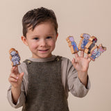 Boy with wooden finger puppets.