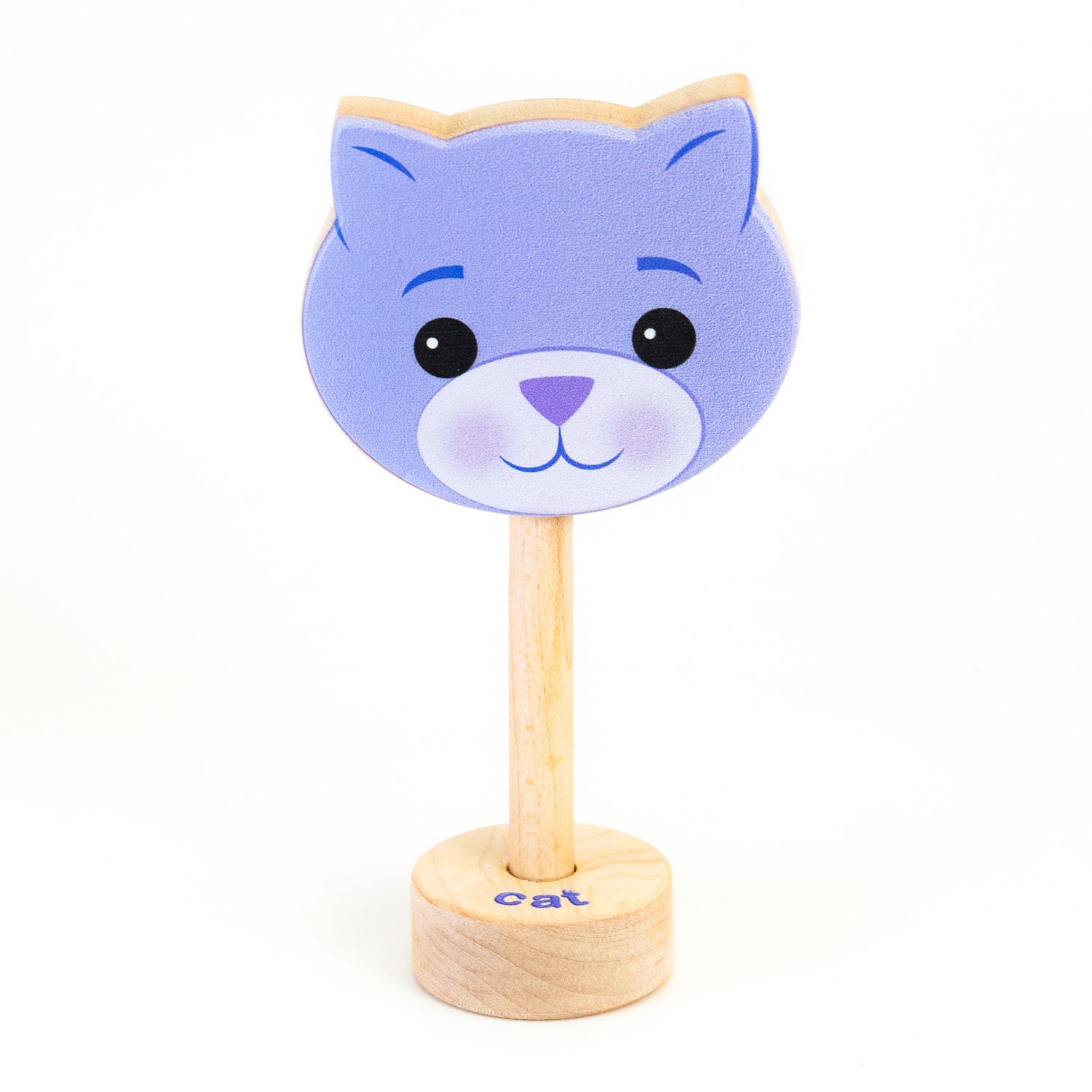 A wooden rattle with a purple cat face, a long wooden dowel for grasping and a small base with the word "cat" spelled out. 