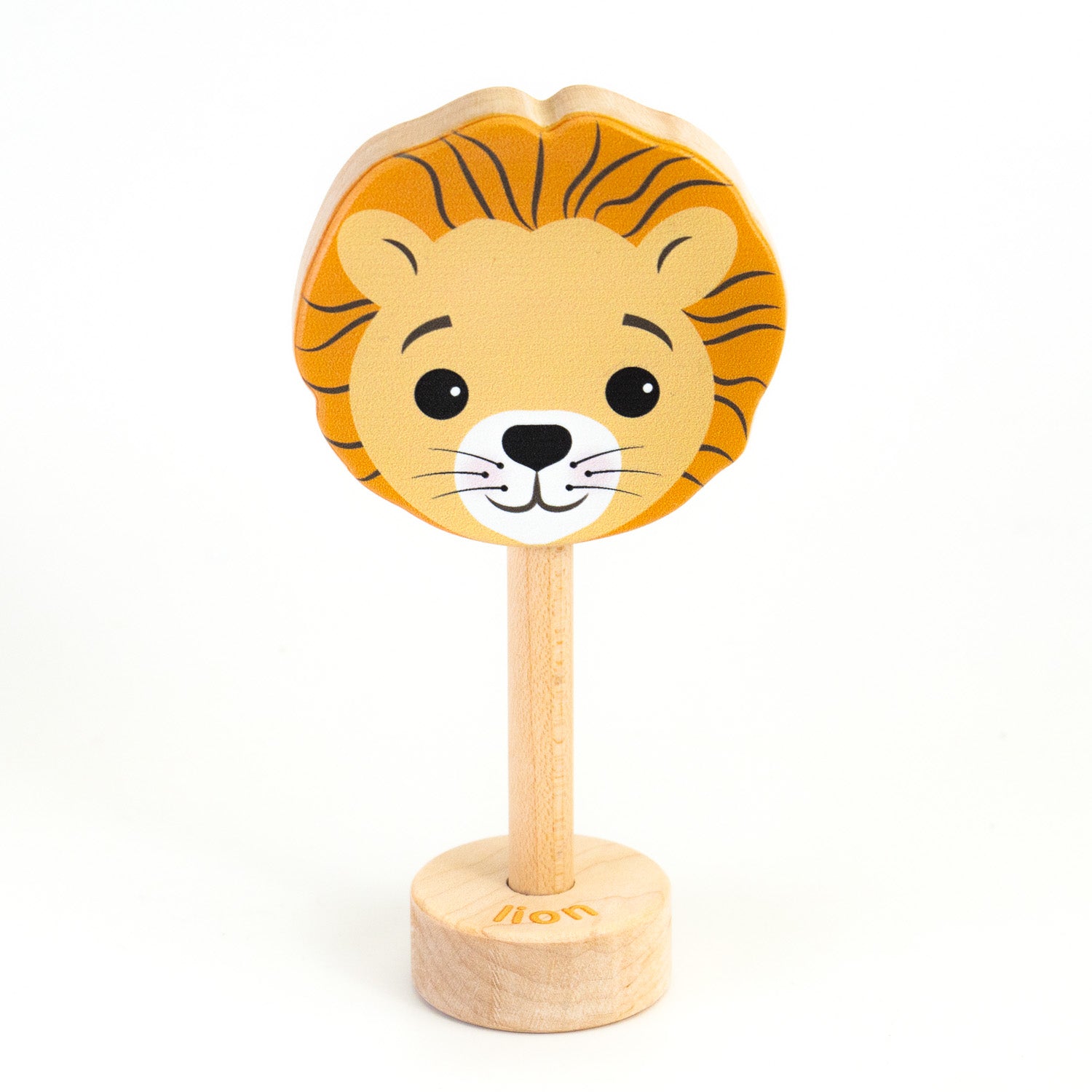 A wooden rattle with a lion face, a long wooden dowel for grasping and a small base with the word "lion" spelled out. 