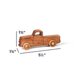 A wooden toy pickup truck shown on a white background with dimension lines and labels indicating its height of 1 3/4 inches, width of 5 1/2 inches, and wheel diameter of 1 3/4 inches.