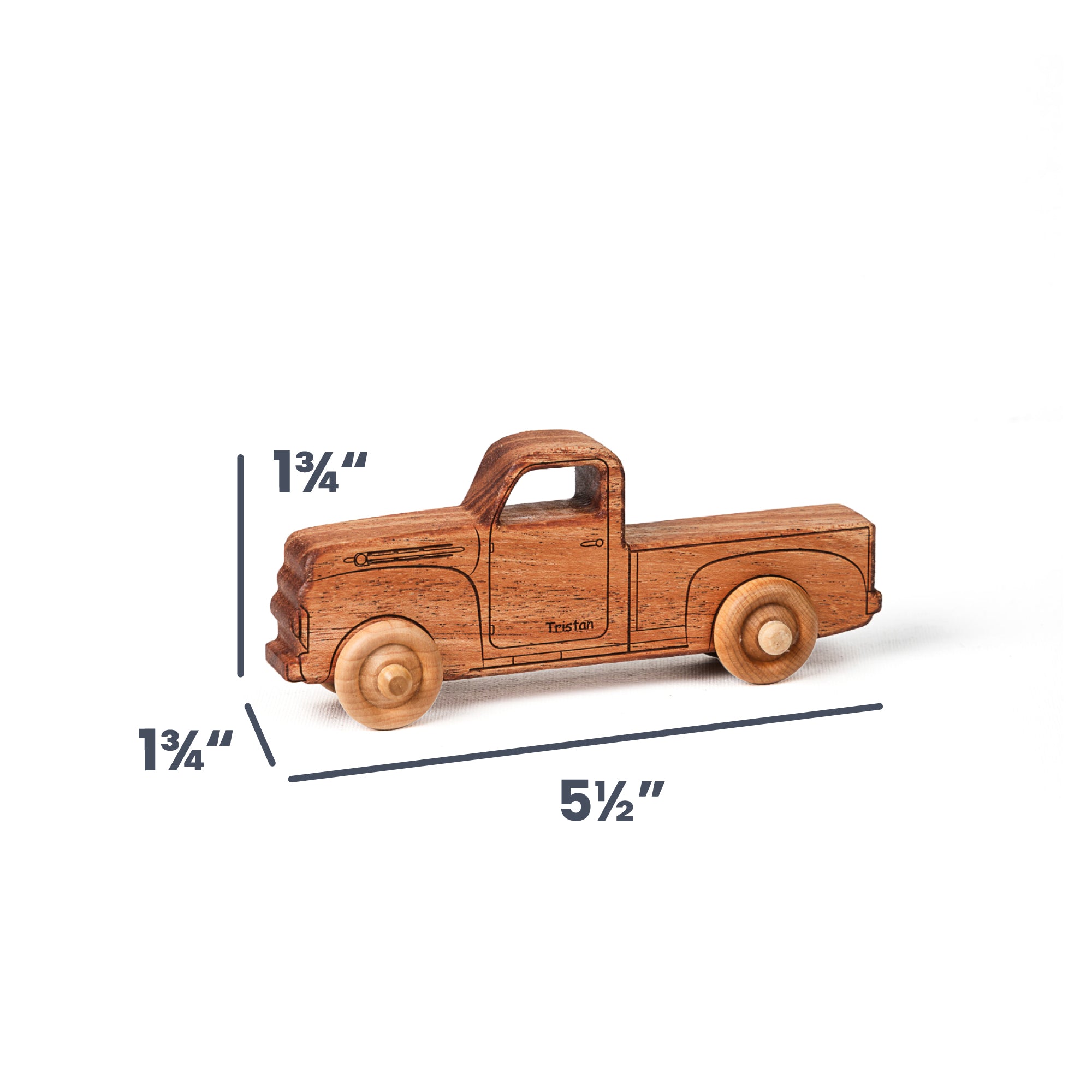 A wooden toy pickup truck shown on a white background with dimension lines and labels indicating its height of 1 3/4 inches, width of 5 1/2 inches, and wheel diameter of 1 3/4 inches.