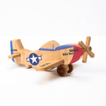 A hand-carved wooden airplane toy with a classic design, featuring a multicolored body with historical military aircraft markings, and a wooden propeller.
