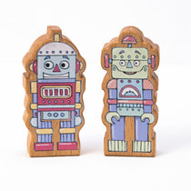 Two wooden finger puppet robots with colorful details, designed for children's imaginative play.