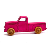 Pink dyed 1950s wooden truck.