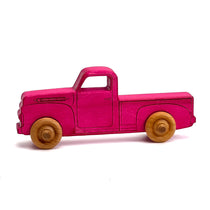 Pink dyed 1950s wooden truck.