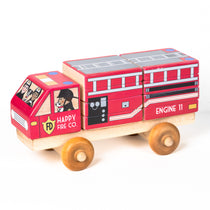 A wooden 3D puzzle truck resembling a fire truck with red body, white and grey details, and wooden wheels.