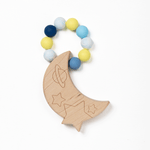 A silicone bead teether in the shape of a crescent moon with stars, connected to a chain of round blue and yellow beads.