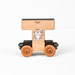 Wooden toy car shaped like the letter 'T' with a tiger design on a white background