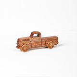 Wooden pickup truck on a white background.