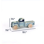 A small vintage-style wooden toy truck with a distressed blue finish and natural wood wheels, shown on a white background with dimension lines indicating 1 3/4 inches height, 1 3/4 inches depth, and 5 1/2 inches width.
