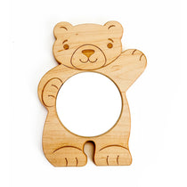 A wooden bear with a mirror that are great for baby tummy time.